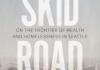 Skid Road Book Cover. Skid and Road are stacked on top of one another in large white lettering with the subititle "on the frontier of health and homelessness in Seattle" appearing in smaller letters in between. 