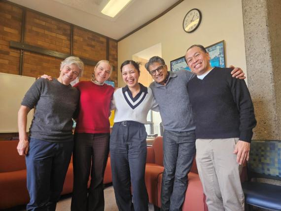 Marielle Marcaida celebrating with her dissertation committee — Cricket Keating, Amanda Swarr, Chandan Reddy, and Rick Bonus — after passing her PhD general exams.