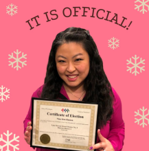 Dr. Nina Kim Hanson Holding Certificate of Election Win