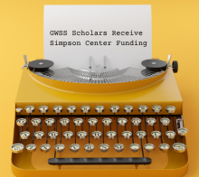 Typewriter with a yellow background. The paper in the typewriter reads "GWSS Scholars Receive Simpson Center Funding"