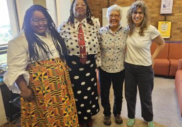 Dr. KT standing with their committee members