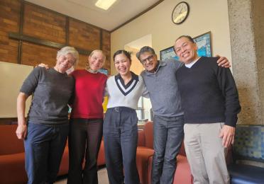 Marielle Marcaida celebrating with her dissertation committee — Cricket Keating, Amanda Swarr, Chandan Reddy, and Rick Bonus — after passing her PhD general exams.