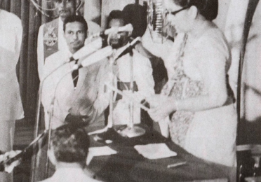 A black-and-white photograph showing Sri Lankan Prime Minister Sirimavo Bandaranaike, the world's first female leader of a country, appointed in 1960.