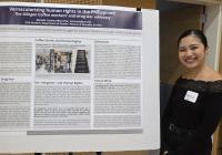 Marielle Marcaida, a GWSS PhD student, stands smiling beside her research poster at the 2025 UW Labor Studies Awards Celebration.